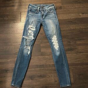Distressed AE next level stretch skinny jeans